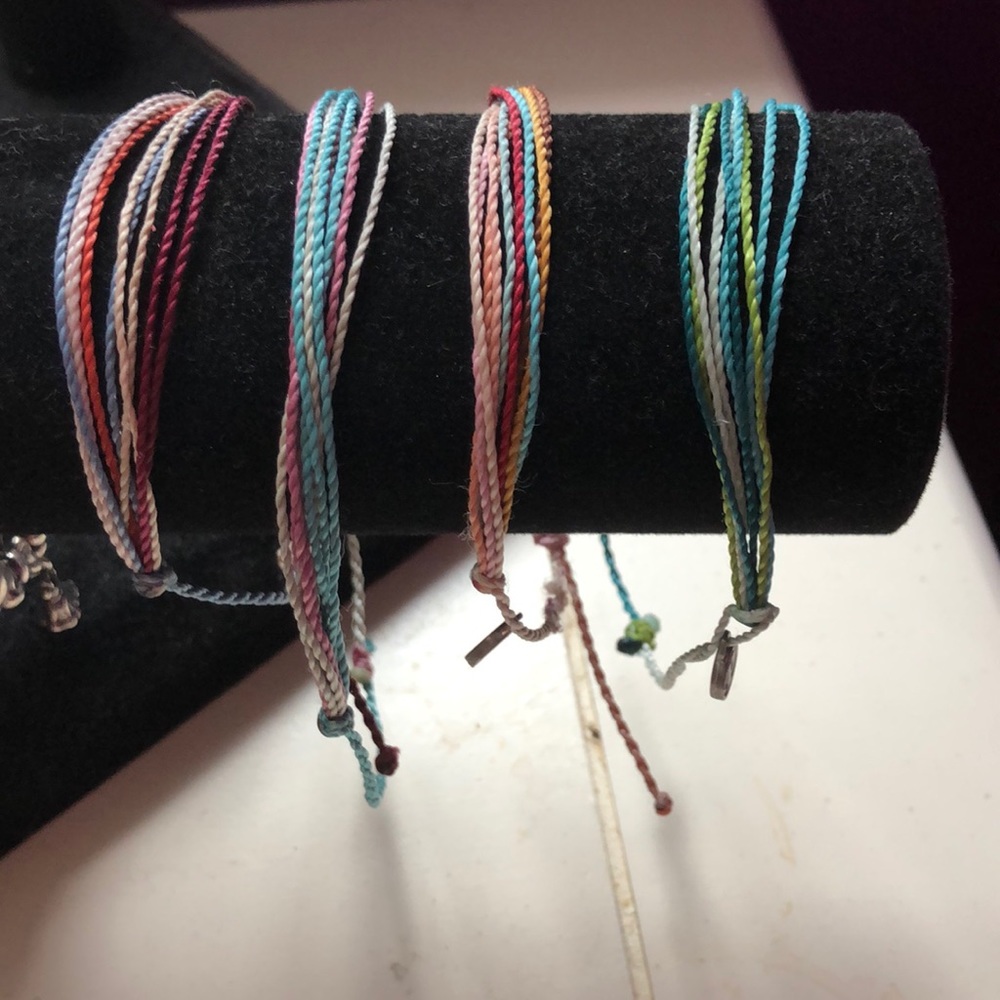 Four purivida bracelets.